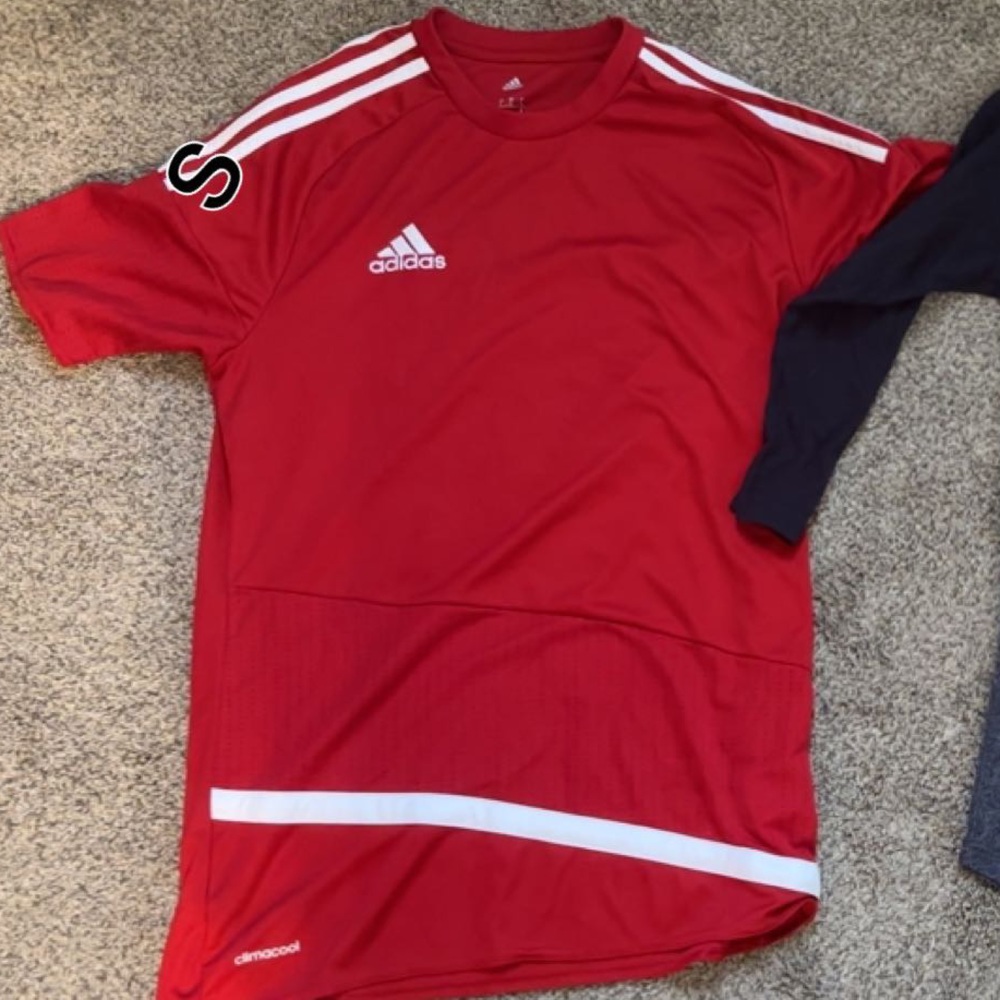 A red Adidas tshirt